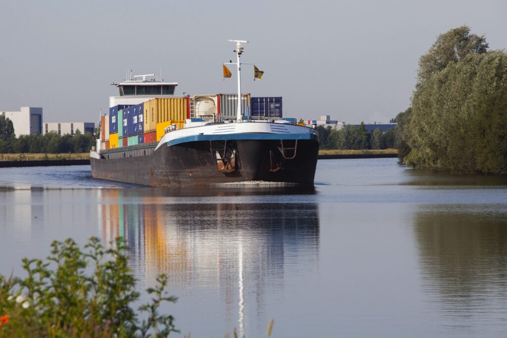 Riverboat, barge Netherlands. Inland shipping. Container ship. M